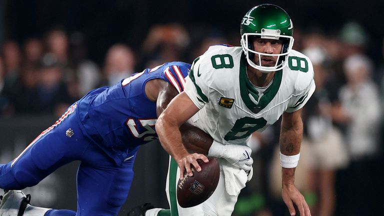 New York Jets quarterback Aaron Rodgers is sacked by defensive end Leonard Floyd of the Buffalo Bills