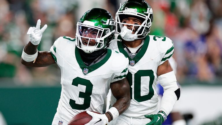 New York Jets safety Jordan Whitehead (3) and cornerback Michael Carter II (30) celebrate after Whitehead intercepted a pass against the Buffalo Bills during the third quarter of an NFL football game, Monday, Sept. 11, 2023, in East Rutherford, N.J.